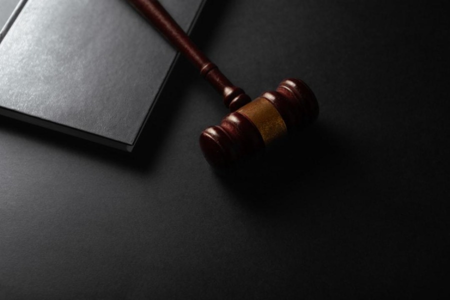 Legal documents and a gavel on a desk